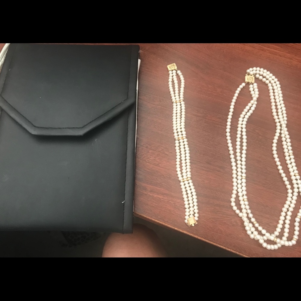 Triple strand pearl necklace and bracelet.